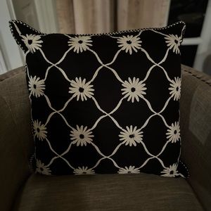 Single throw pillow with floral accents
